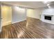 Spacious living room with wood-look floors and fireplace at 7995 E Mississippi Ave # F11, Denver, CO 80247