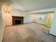 Basement featuring carpet flooring, a fireplace, and natural light from the windows at 19954 E Dartmouth Ave, Aurora, CO 80013