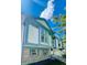 Two-story home with light-blue trim and brick on a sunny day at 19954 E Dartmouth Ave, Aurora, CO 80013
