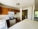 Eat-in kitchen with classic appliances and view into the living room at 19954 E Dartmouth Ave, Aurora, CO 80013