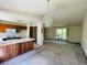 Eat-in kitchen with view into the living room and stairway to upper level at 19954 E Dartmouth Ave, Aurora, CO 80013