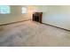 Living room with a fireplace, carpet, and natural light from the windows at 19954 E Dartmouth Ave, Aurora, CO 80013
