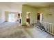 Spacious living room leading to kitchen and stairway to upper level at 19954 E Dartmouth Ave, Aurora, CO 80013