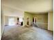 Spacious living room leading to kitchen and outdoor patio area at 19954 E Dartmouth Ave, Aurora, CO 80013