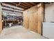 Unfinished basement with storage cabinets and workbench offers ample space for customization and organization at 3224 Troy St, Aurora, CO 80011