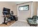 Bright bedroom with hardwood floors, neutral walls, with a comfortable reading chair at 3224 Troy St, Aurora, CO 80011