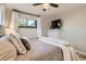 Inviting bedroom featuring hardwood floors, comfortable decor, and bathed in natural light at 3224 Troy St, Aurora, CO 80011
