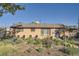 Charming single-story brick home with a well-maintained front yard and inviting curb appeal with seating area at 3224 Troy St, Aurora, CO 80011