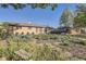 Beautifully landscaped front yard with a variety of plants enhances the curb appeal of this inviting home at 3224 Troy St, Aurora, CO 80011