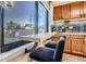 Kitchen features a window with a built-in breakfast bar, providing a bright spot for enjoying coffee at 3224 Troy St, Aurora, CO 80011