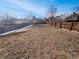 Wide shot of a fenced backyard with a large expanse of grass at 3125 S Gibralter St, Aurora, CO 80013