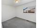 Cozy bedroom with soft gray carpet, a large window, and neutral paint at 3125 S Gibralter St, Aurora, CO 80013