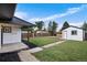 Spacious backyard with detached workshop and freshly cut lawn at 30 S Yates St, Denver, CO 80219