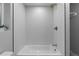 Clean bathroom with a shower/tub combo and modern fixtures at 30 S Yates St, Denver, CO 80219