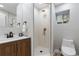 Modern bathroom with a walk-in shower and updated vanity at 30 S Yates St, Denver, CO 80219