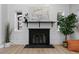 Modern fireplace with a sleek black surround at 30 S Yates St, Denver, CO 80219