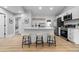 Modern kitchen with white cabinets and a large island at 30 S Yates St, Denver, CO 80219