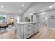 Updated kitchen featuring white cabinetry and a center island at 30 S Yates St, Denver, CO 80219