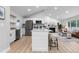 Modern kitchen with stainless steel appliances and island at 30 S Yates St, Denver, CO 80219