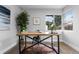 Home office with large window and stylish wooden desk at 30 S Yates St, Denver, CO 80219