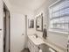 Bright bathroom with vanity, toilet and window at 9125 Bell Flower Way, Highlands Ranch, CO 80126