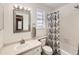 Clean bathroom with shower/tub combo, toilet and vanity at 9125 Bell Flower Way, Highlands Ranch, CO 80126