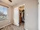 Walk-in closet with ample shelving and hanging space at 9125 Bell Flower Way, Highlands Ranch, CO 80126