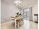 Bright dining area with table and chairs near sliding door at 9125 Bell Flower Way, Highlands Ranch, CO 80126