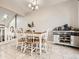 Dining area with table, chairs and sideboard at 9125 Bell Flower Way, Highlands Ranch, CO 80126