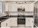 Modern kitchen with stainless steel appliances and white cabinets at 9125 Bell Flower Way, Highlands Ranch, CO 80126