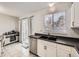 Kitchen with double sink, dishwasher and window at 9125 Bell Flower Way, Highlands Ranch, CO 80126