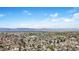 Scenic aerial shot highlights the community's backdrop of rolling mountains, blending nature with residential living at 3341 W 94Th Ave, Westminster, CO 80031