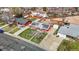 An aerial view showcases a red brick home with a solar panel roof, nestled in a residential area at 3341 W 94Th Ave, Westminster, CO 80031