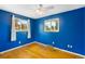 Bedroom features hardwood floors, ceiling fan, and natural light from two windows at 3341 W 94Th Ave, Westminster, CO 80031