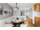 Dining room featuring a modern chandelier and seating for four at 3341 W 94Th Ave, Westminster, CO 80031