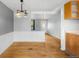Cozy dining room features hardwood floors, white wainscotting, and vintage lighting fixtures at 3341 W 94Th Ave, Westminster, CO 80031