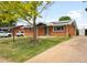 Charming brick home with a well-maintained lawn, mature tree, and a long driveway leading to the backyard at 3341 W 94Th Ave, Westminster, CO 80031