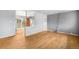 Bright living room features hardwood flooring, neutral paint, and sliding glass doors to a fenced backyard at 3341 W 94Th Ave, Westminster, CO 80031