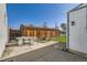 Backyard features a patio area, mature shade trees, and a detached garage at 4354 Chase St, Denver, CO 80212