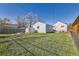 A large, green backyard features a small storage shed and a detached garage at 4354 Chase St, Denver, CO 80212