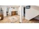 Bright basement features wood floors, white walls, storage, and access to other areas at 4354 Chase St, Denver, CO 80212