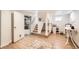 Basement space with wood floors and stairs leading up, ready for flexible use at 4354 Chase St, Denver, CO 80212