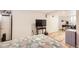Basement bedroom featuring a bed, table, TV, desk and closet at 4354 Chase St, Denver, CO 80212