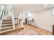 Basement space with stairs, hardwood floors, and ample room for activities at 4354 Chase St, Denver, CO 80212
