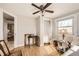 Inviting bedroom with ceiling fan, hardwood floors, and a sun-drenched window at 4354 Chase St, Denver, CO 80212