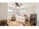 Bright bedroom with hardwood floors, a ceiling fan, and a comfortable bed at 4354 Chase St, Denver, CO 80212