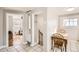 Cozy dining area featuring tile floors, a table, and a staircase leading upstairs at 4354 Chase St, Denver, CO 80212