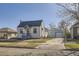 Charming single-story home with a well-maintained front yard and detached two car garage at 4354 Chase St, Denver, CO 80212
