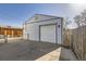 Detached one car garage with an adjacent, fenced parking area at 4354 Chase St, Denver, CO 80212