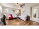 Bright living room featuring hardwood floors, ceiling fan, and neutral wall paint at 4354 Chase St, Denver, CO 80212